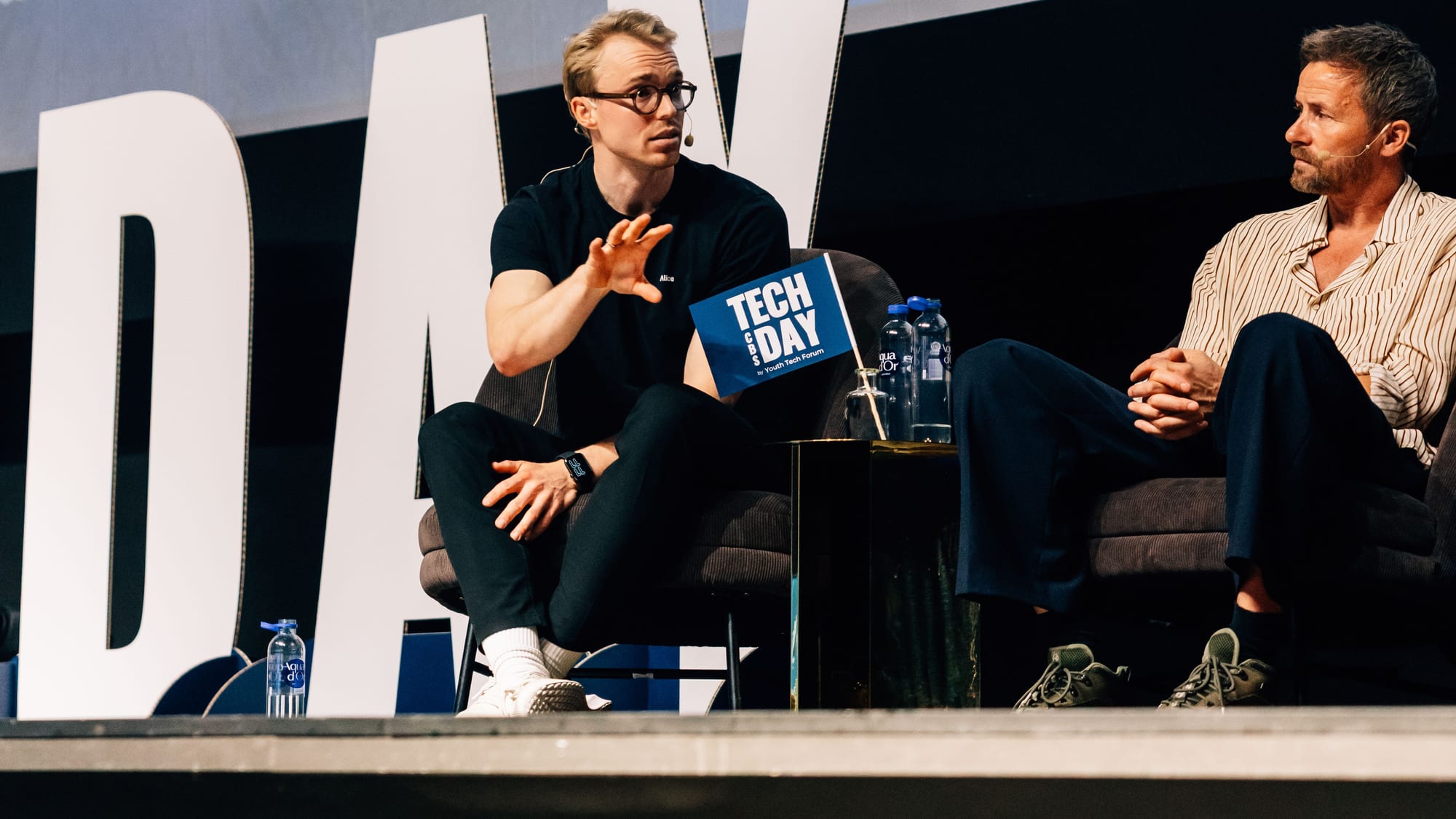 Kim Rants speaking on stage at Tech Day